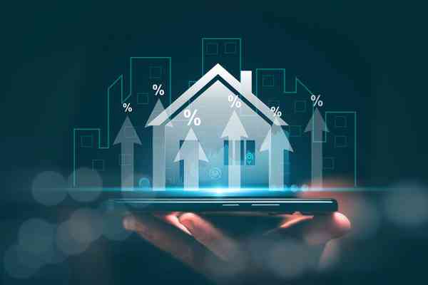 Hologramm eines Hauses auf einer Hand